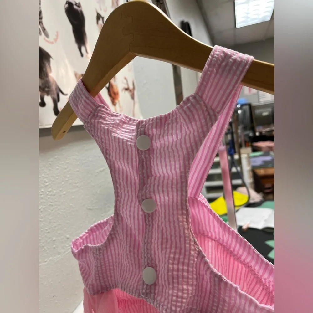 Pink and white striped ruffled dog dress with suspenders